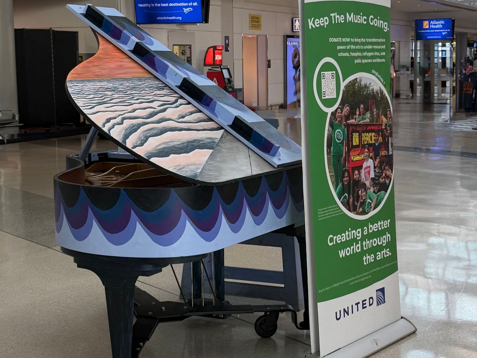 Photo of Sing for Hope Piano — Gate C74 at Newark Liberty International Airport, 3 Brewster Road, Newark NJ 07114. Terminal C, Gate C74 after security; airport page invites…