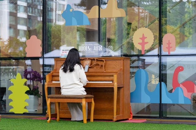Photo of Piano Seoul — Gangdong Arts Center at 동남로, 명일동, 명일2동, 강동구, 서울특별시, 05271, 대한민국. A free Piano Seoul instrument near the main entrance of Gangdong Arts Center.…