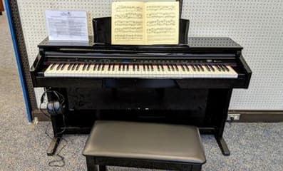 Photo of Digital Piano — Central Santa Rosa Library at 211 E St, Santa Rosa, CA 95404. A public digital piano at the Central Santa Rosa Library, used with headphones…