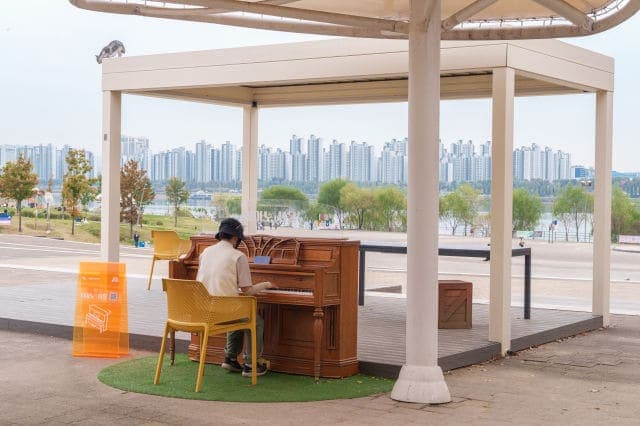 Photo of Piano Seoul — Ttukseom Hangang Park at 강변북로, 자양2동, 광진구, 서울특별시, 05110, 대한민국. A free outdoor Piano Seoul instrument near Jayang Station in Ttukseom Hangang…