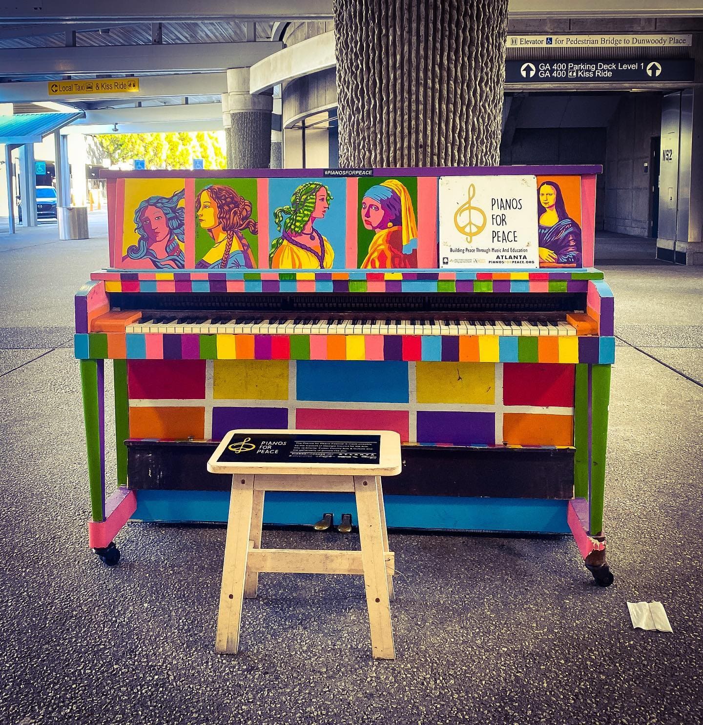 A brightly painted public piano in an Atlanta transit station