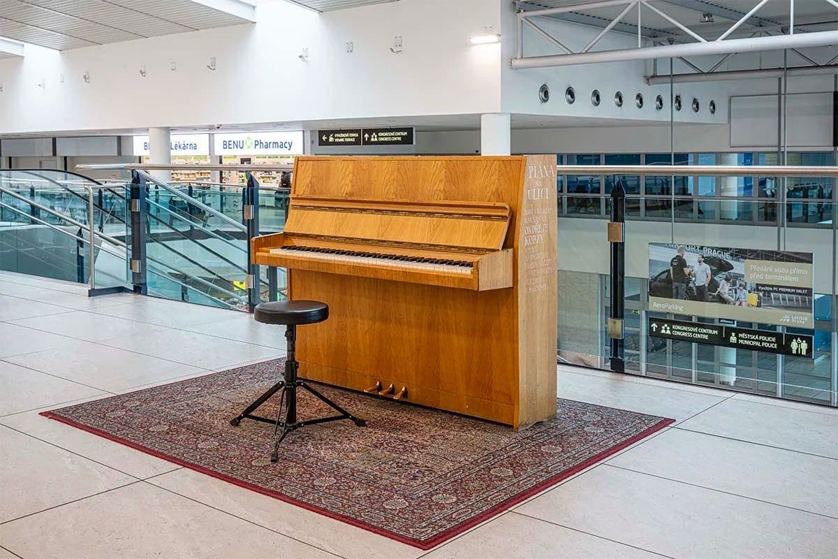 Photo of Prague International Airport (terminal 2) at Terminal 2, Aviatická, Ruzyně, Prague, 25267, Czechia. A freely accessible piano in the public part of Václav Havel Airport…
