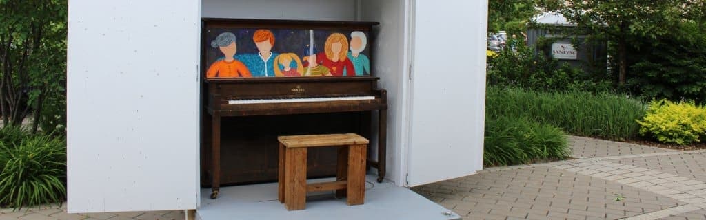 Photo of Halte du Village public piano at Montée Robert at rue Savaria, Saint-Basile-le-Grand QC. Everyone may play daily 09:00–20:00 through September 2026, weather permitting.