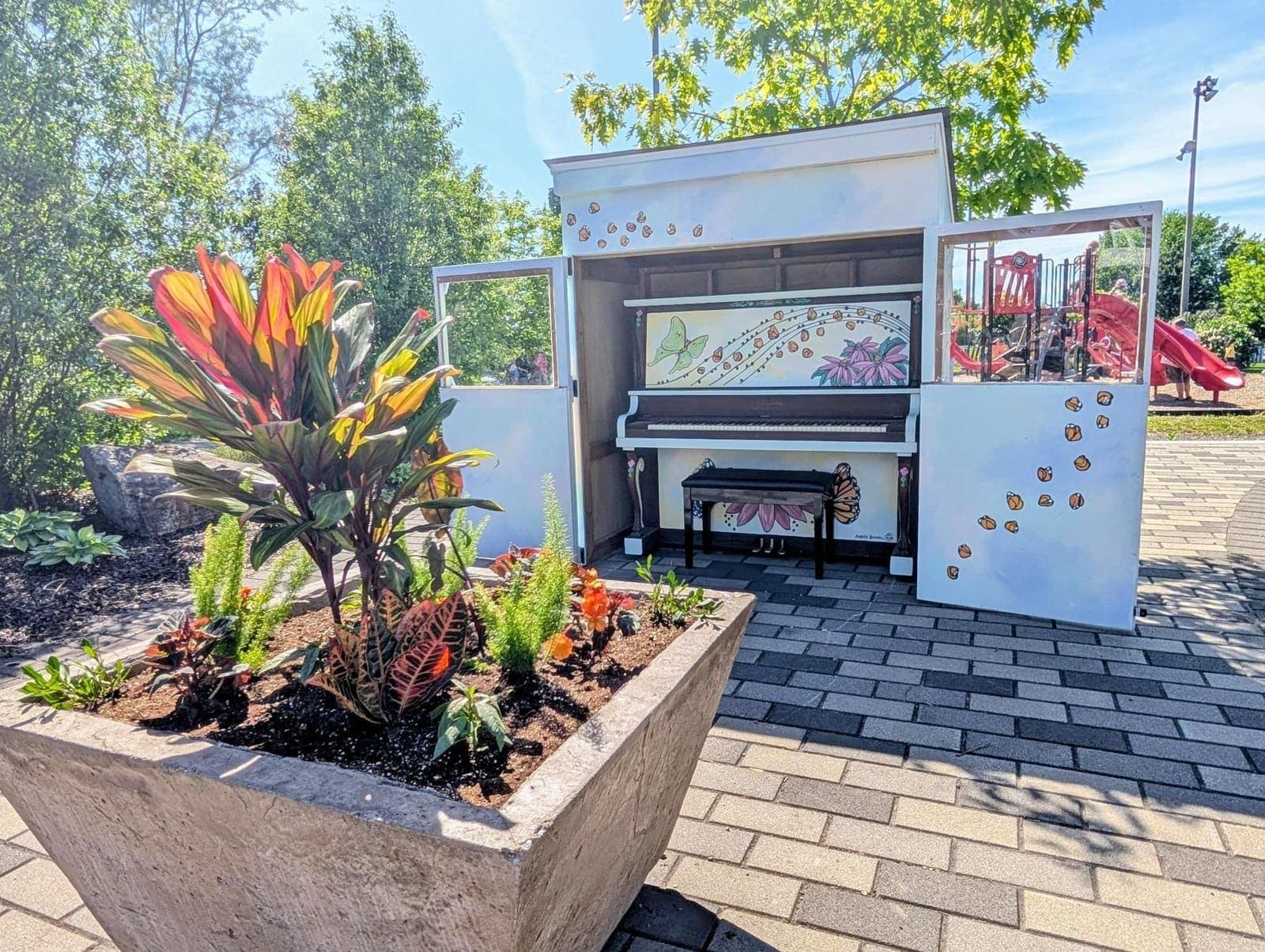 Photo of Parc Wilfrid-Boardman public piano at 59 rue Boardman, Delson QC J5B 1Y7. Morning through evening, weather permitting, 2026-06-15 through mid-September.